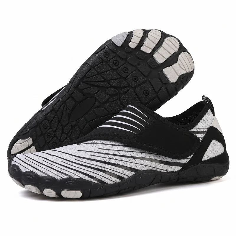 Natueva lichte & flexibele barefoot schoenen – Zwart-wit, zijaanzicht en zool